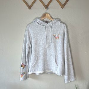 Light gray embroidered hoodie by Betsy Johnson